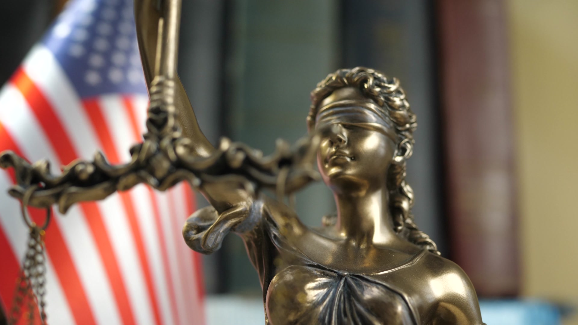Lady Justice with American flag, representing immigration law expertise
